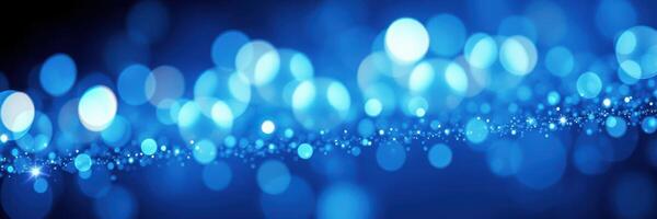 Shimmering blue bokeh lights create a magical ambiance at a night event photo