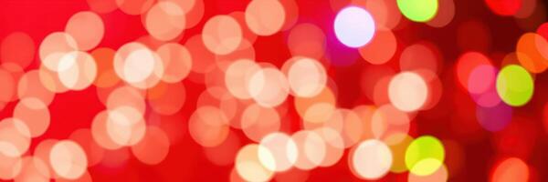 Colorful bokeh lights create a festive atmosphere during a winter celebration in an indoor setting at night photo