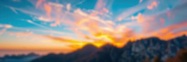 Beautiful sunset over mountain landscape showcasing vibrant colors and dramatic clouds in evening sky photo