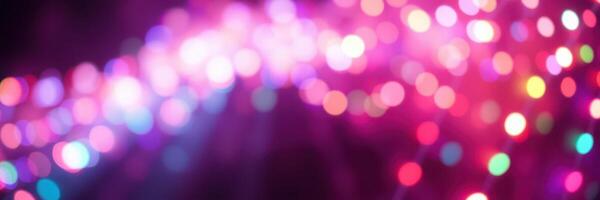 Colorful bokeh lights create a festive atmosphere during a night celebration in a vibrant outdoor setting photo