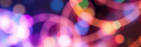 Colorful light patterns create a vibrant atmosphere at a lively nighttime celebration photo