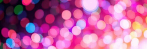 Colorful bokeh lights create a vibrant atmosphere during a nighttime celebration or event photo