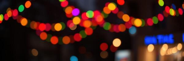 Colorful string lights illuminate a festive street during evening celebrations in a vibrant urban area photo