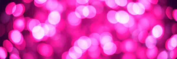 Vibrant pink bokeh background creates a festive atmosphere for celebrations and gatherings photo