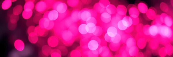 Bright pink bokeh lights create a vibrant atmosphere for celebrations and events photo