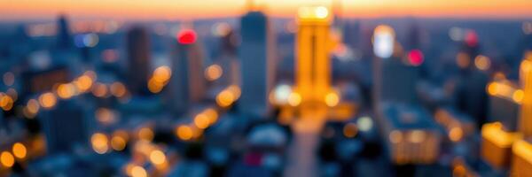 Urban skyline at dusk with glowing lights and blurred cityscape photo