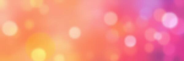 Colorful abstract background with blurry bokeh effect in hues of pink, orange, and purple photo