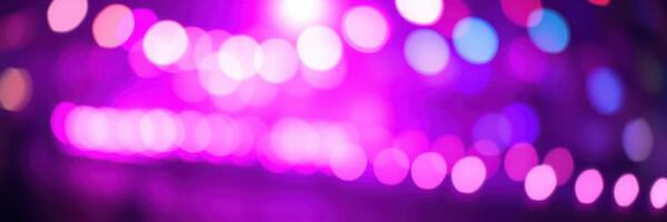 Colorful lights create a vibrant atmosphere during a night event at an outdoor venue photo