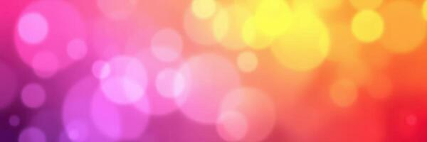 Vibrant abstract background featuring colorful bokeh lights in shades of pink, yellow, and orange photo