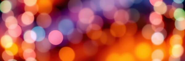 Colorful bokeh lights create a vibrant atmosphere during a festive evening celebration in the city photo