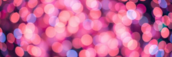 Colorful bokeh lights create a festive atmosphere during a celebration at night in an urban setting photo