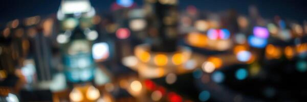 Nighttime city skyline is illuminated with vibrant lights and blurred urban atmosphere creating an energetic backdrop photo