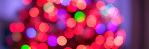 Bright and colorful bokeh lights create a festive atmosphere during a holiday celebration at home in the evening photo