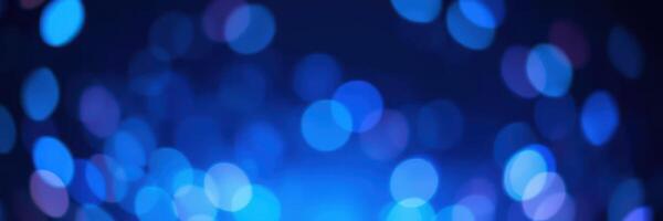 Colorful blue bokeh lights create a dreamy atmosphere at a night event in an urban setting photo