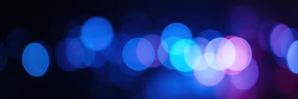 Colorful bokeh lights create a vibrant and blurry background at an evening event photo