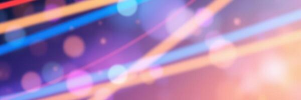 Colorful abstract lights create a vibrant backdrop during a lively nighttime event in a urban setting photo