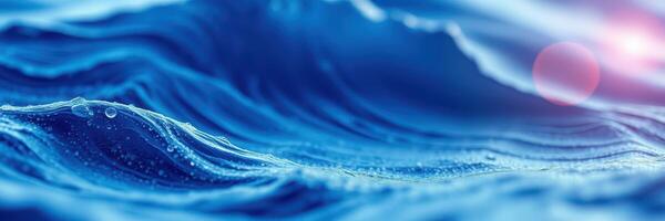 Rippling waves under sunlight create a tranquil blue seascape with gentle textures and soothing colors photo