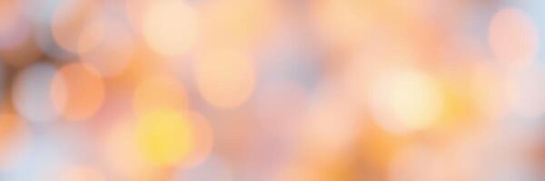 Beautiful golden and orange bokeh lights create a warm and inviting atmosphere during a sunset in an outdoor setting photo