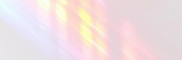 Colorful light reflections dance across a smooth surface in a softly lit room during a late evening photo