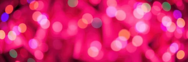 Colorful bokeh lights create a vibrant atmosphere during a festive evening celebration in a city photo