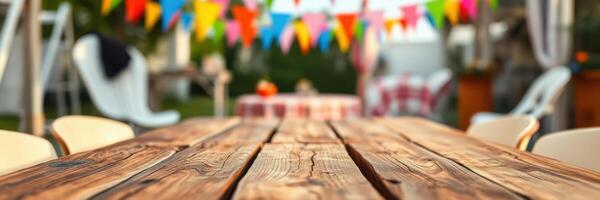 Colorful decorations enhance a festive outdoor gathering with rustic wooden table and cheerful atmosphere photo