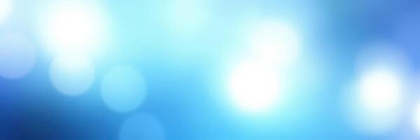 Soft blue abstract background with light bokeh effects creating a dreamy atmosphere photo