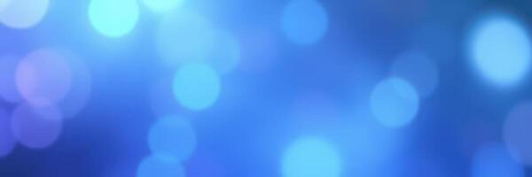 Vibrant blue bokeh lights create a dreamy atmosphere for a festive celebration or event photo