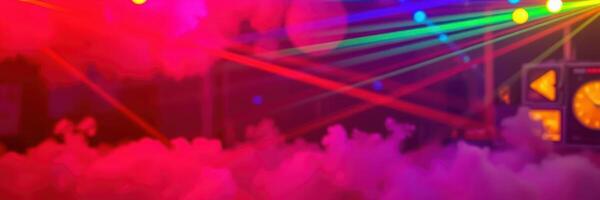 Colorful laser lights create a vibrant atmosphere at a dance party in an indoor venue during nighttime photo