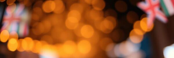 Festive lights illuminate street adorned with flags during a joyful celebration at dusk photo