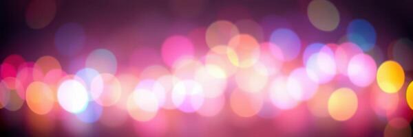 Colorful bokeh lights create a vibrant abstract background during an evening city event photo
