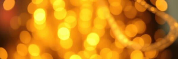 Bright golden bokeh lights create a warm atmosphere during an evening gathering in a cozy indoor space photo