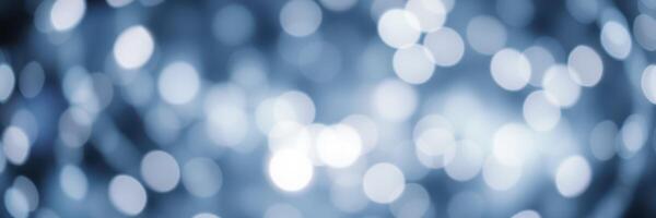 Shimmering blue bokeh lights create a magical atmosphere for celebrations and events at night photo