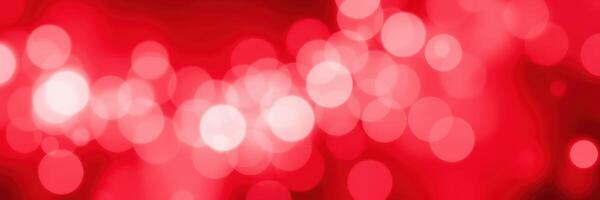 Red bokeh lights create a vibrant and festive atmosphere during an evening celebration photo