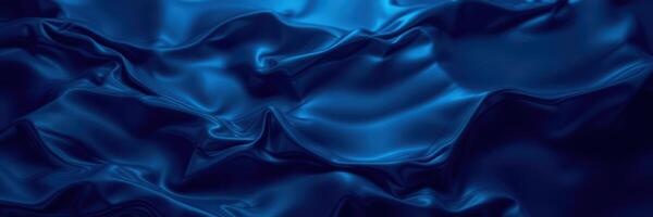Textured blue silk fabric creating elegant waves and folds in soft lighting, highlighting luxurious appearance photo