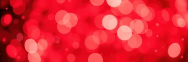 Festive red background with glowing bokeh lights creating a warm and inviting atmosphere for celebrations and gatherings photo