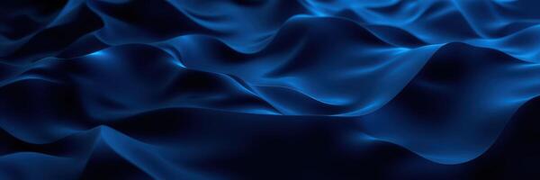 Textured blue fabric cascading in waves under soft lighting photo