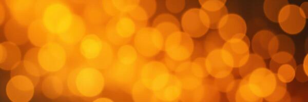 Bright orange bokeh lights create a warm, festive atmosphere during an evening celebration in a cozy indoor setting photo