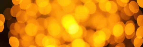 Soft golden lights create a warm ambiance at an evening gathering in an urban setting with blurred backgrounds photo