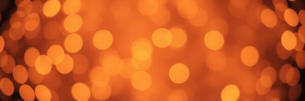Bright orange bokeh lights create a vibrant and warm atmosphere for festive gatherings at night photo