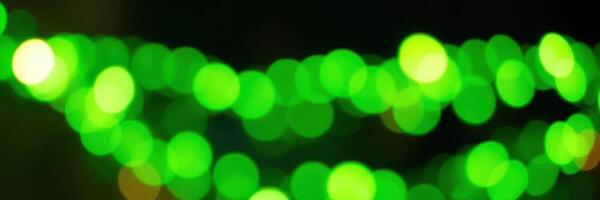 Vibrant green lights create a lively atmosphere at a festive event during an evening gathering in the city photo