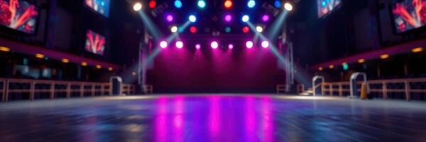 Dramatic lighting frames an empty dance floor in a vibrant nightclub setting during late evening hours photo