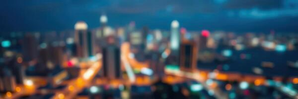 City skyline illuminated at night with blurred lights creating a vibrant urban atmosphere in a modern metropolis photo