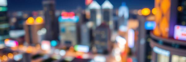 City skyline illuminated at night with blurred lights and bustling urban atmosphere photo