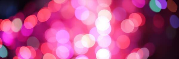 Colorful bokeh lights create a vibrant atmosphere during a nighttime celebration in a lively urban setting photo