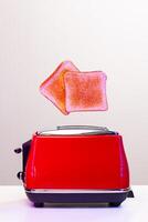 Two toast slices jumping out of toaster in neon light photo