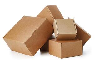 Stacked brown cardboard boxes in various sizes arranged on a white background photo