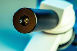 Peephole , optical part of a lab microscope close up photo
