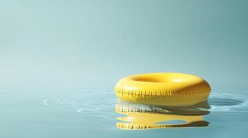 Floating yellow inflatable ring on calm water in serene setting during daylight photo