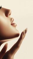Elegant profile of a woman with a soft expression showcasing graceful hand and stylish nails in a serene setting photo