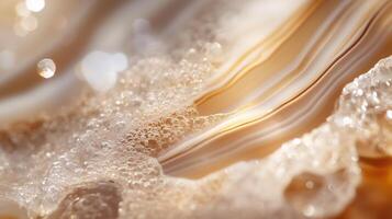 Swirling bubbles and golden swirls create a mesmerizing pattern in water on a sunny day photo